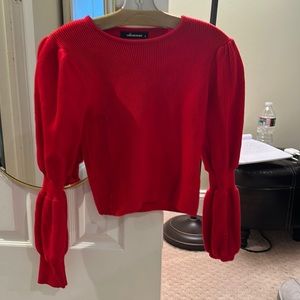 Red sweater interesting sleeves
